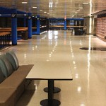 Upper Arena Lobby with table and chairs